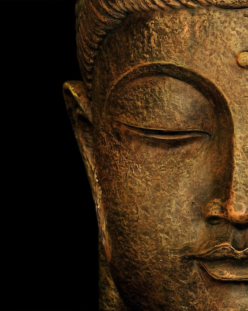 statue representing the portrait of buddha in meditation. copy space.
